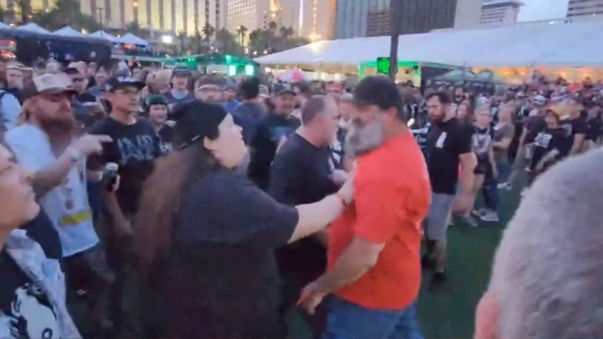 Screenshot from video of man in Nazi shirt at punk festival