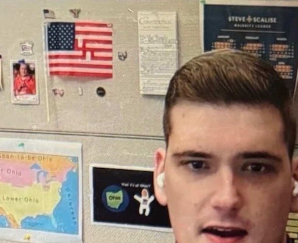 Screenshot from Zoom meeting that shows the swastika American flag in the background