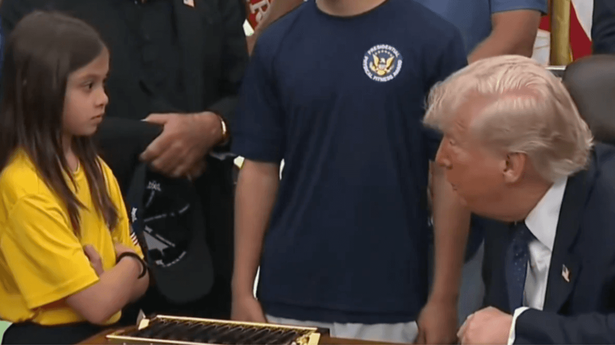 Screenshot of Donald Trump with young volleyball player