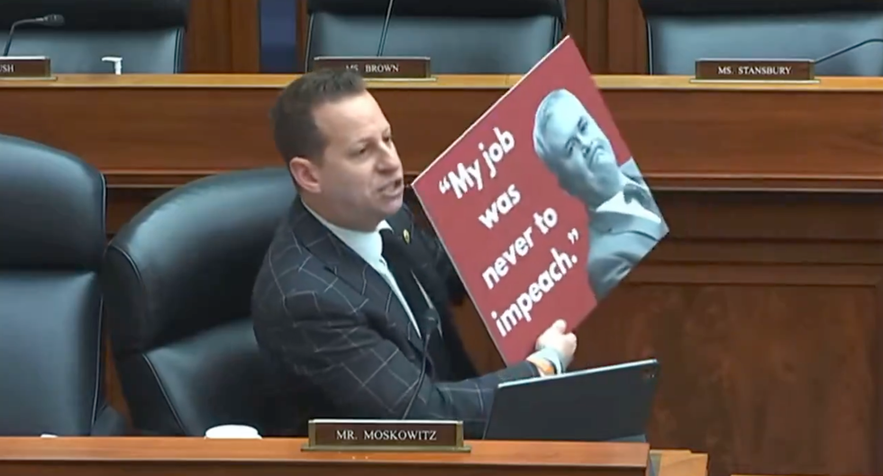 Screenshot of Jared Moskowitz holding up his Comer sign
