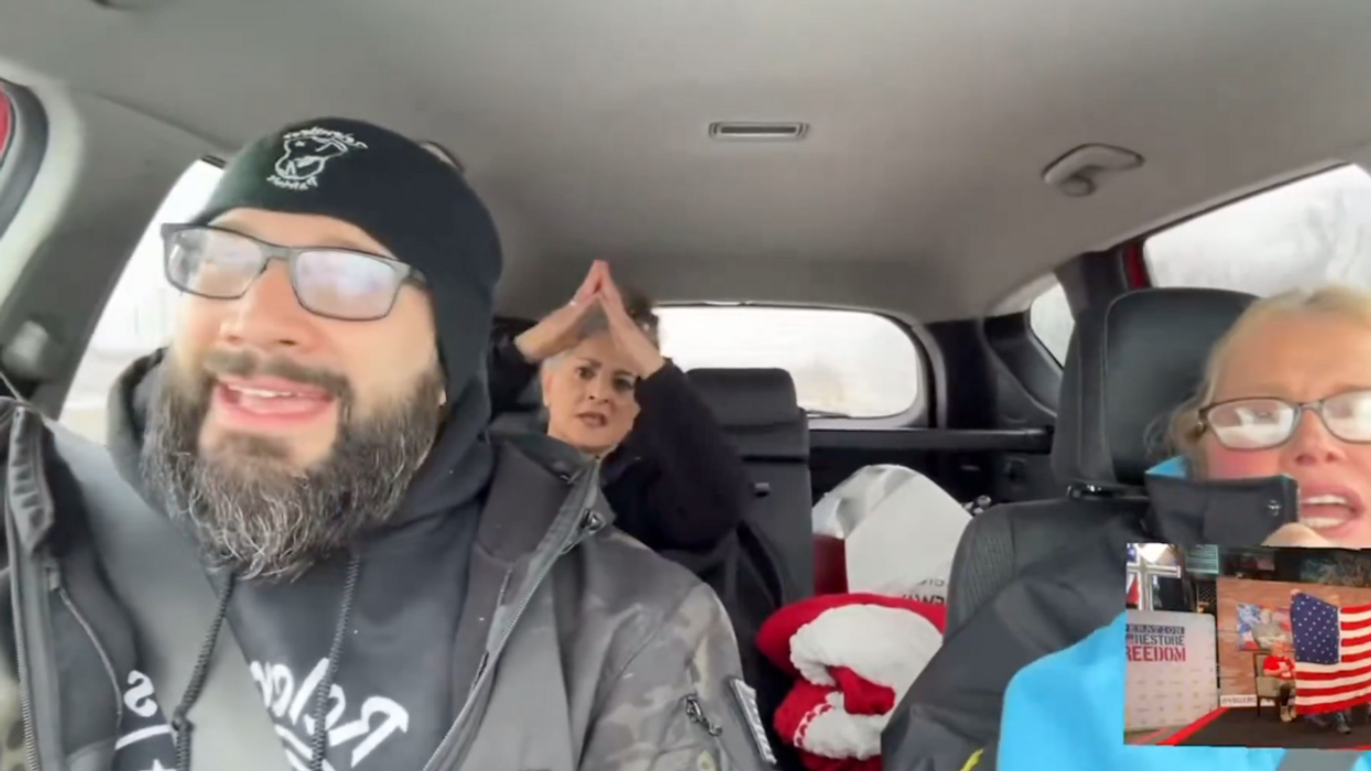Screenshot of MAGA followers singing "YMCA" in car