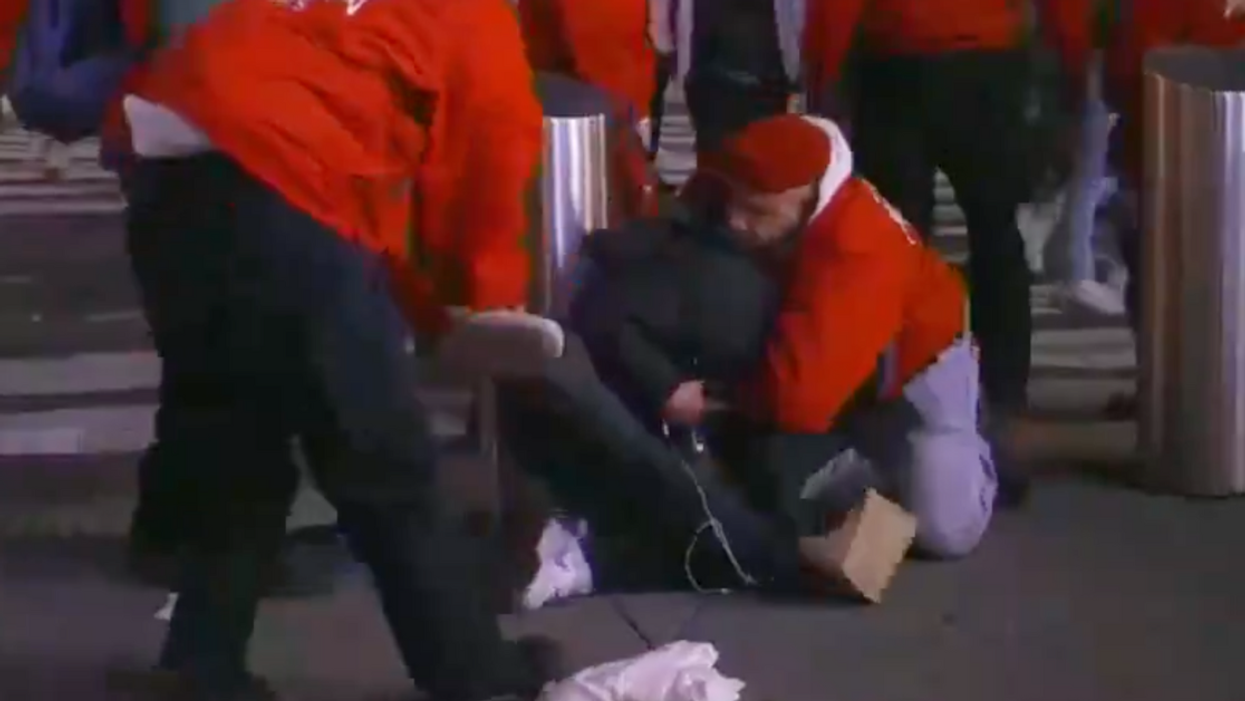 Screenshot of man tackled by vigilante group Guardian Angels