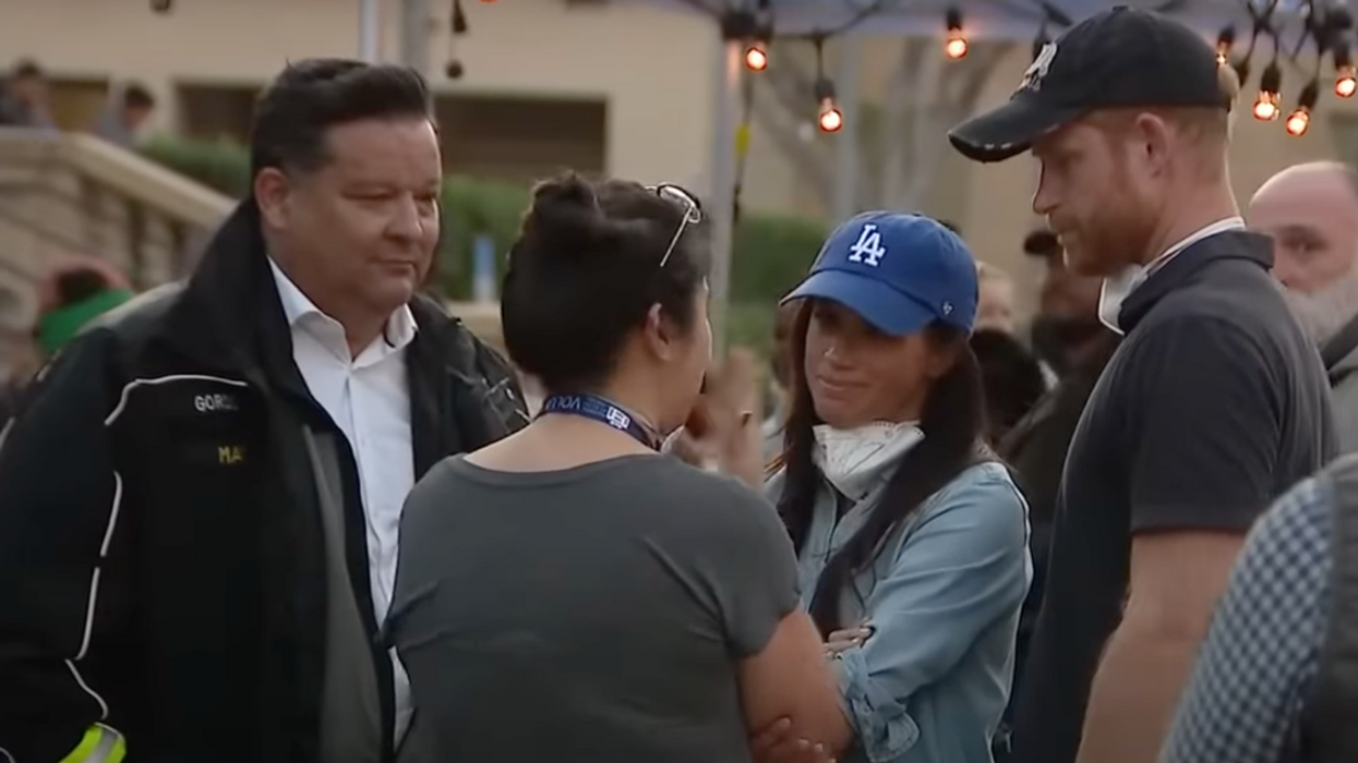 Screenshot of Meghan Markle and Prince Harry speaking with people at Pasadena evacuation site