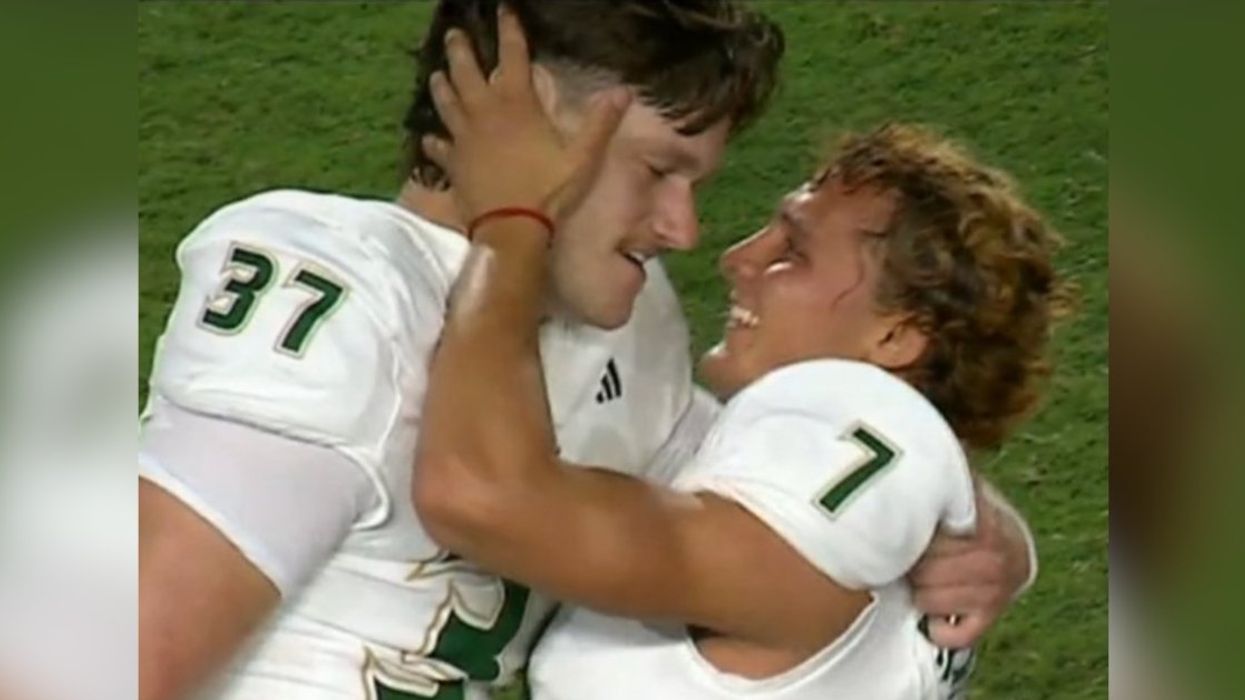 Screenshot of Nico Gramatica and Chase Leon embracing