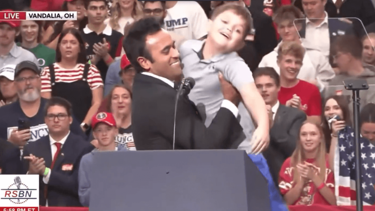 Screenshot of Vivek Ramaswamy picking up boy