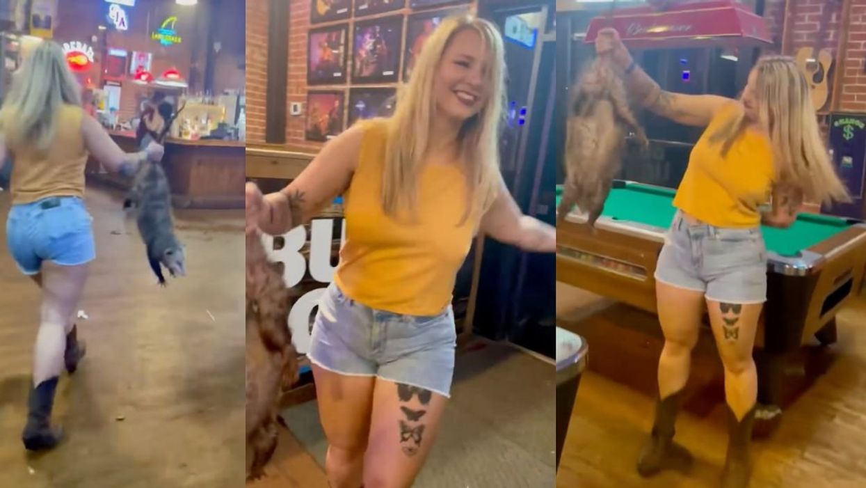 Scrneehosts of Jessica White carrying the stranded opossum