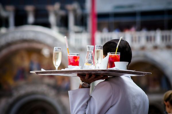 Server with a tray of drinks