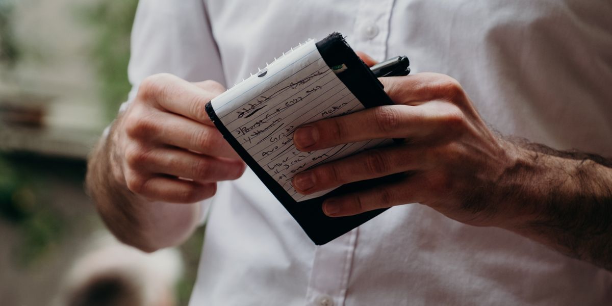 Server writing down a meal order