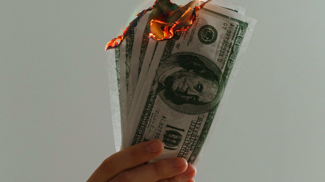 Someone burning money