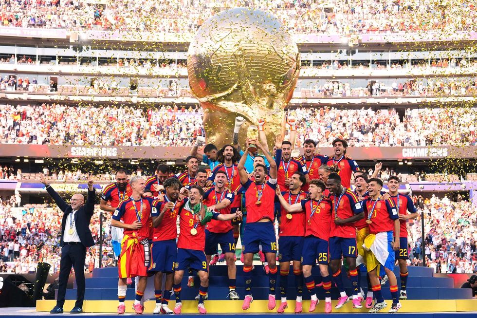 Spain's football association with the World Cup trophy, with Donald Trump edited out