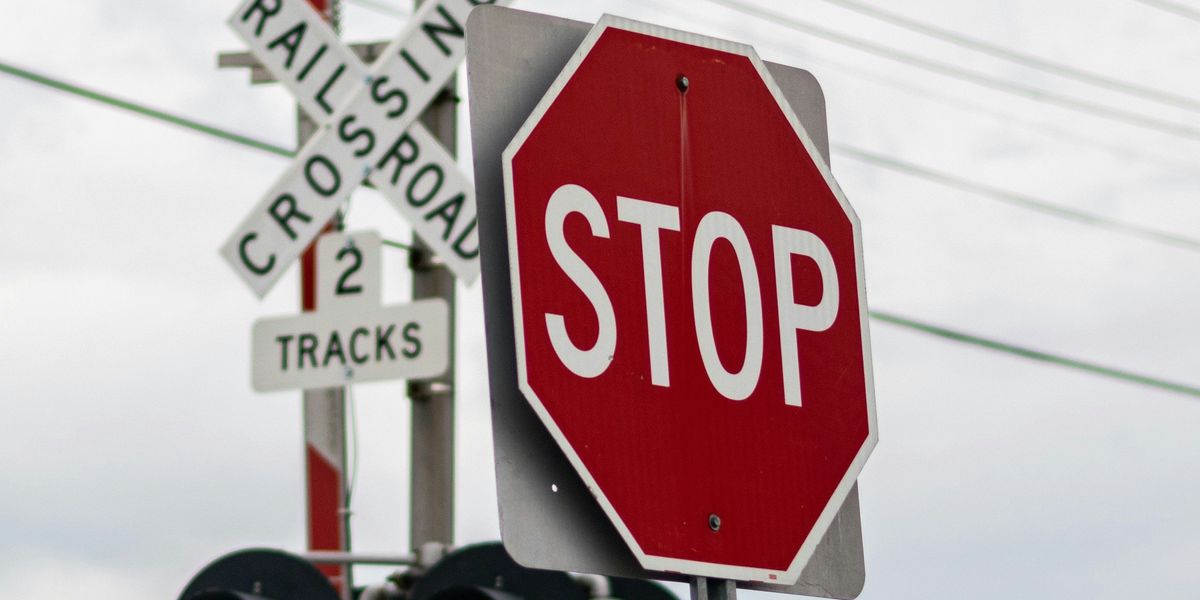 Stop sign at a railroad crossing