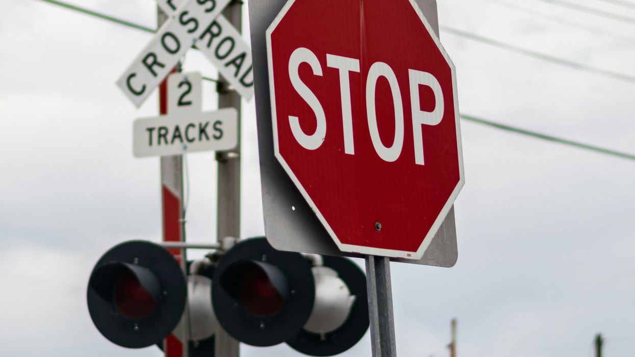 Stop sign at a railroad crossing