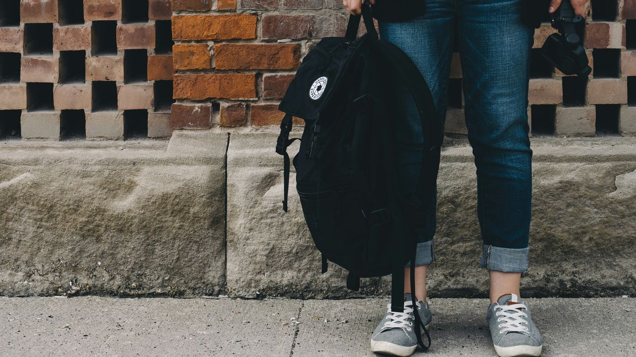 Student holding backpack