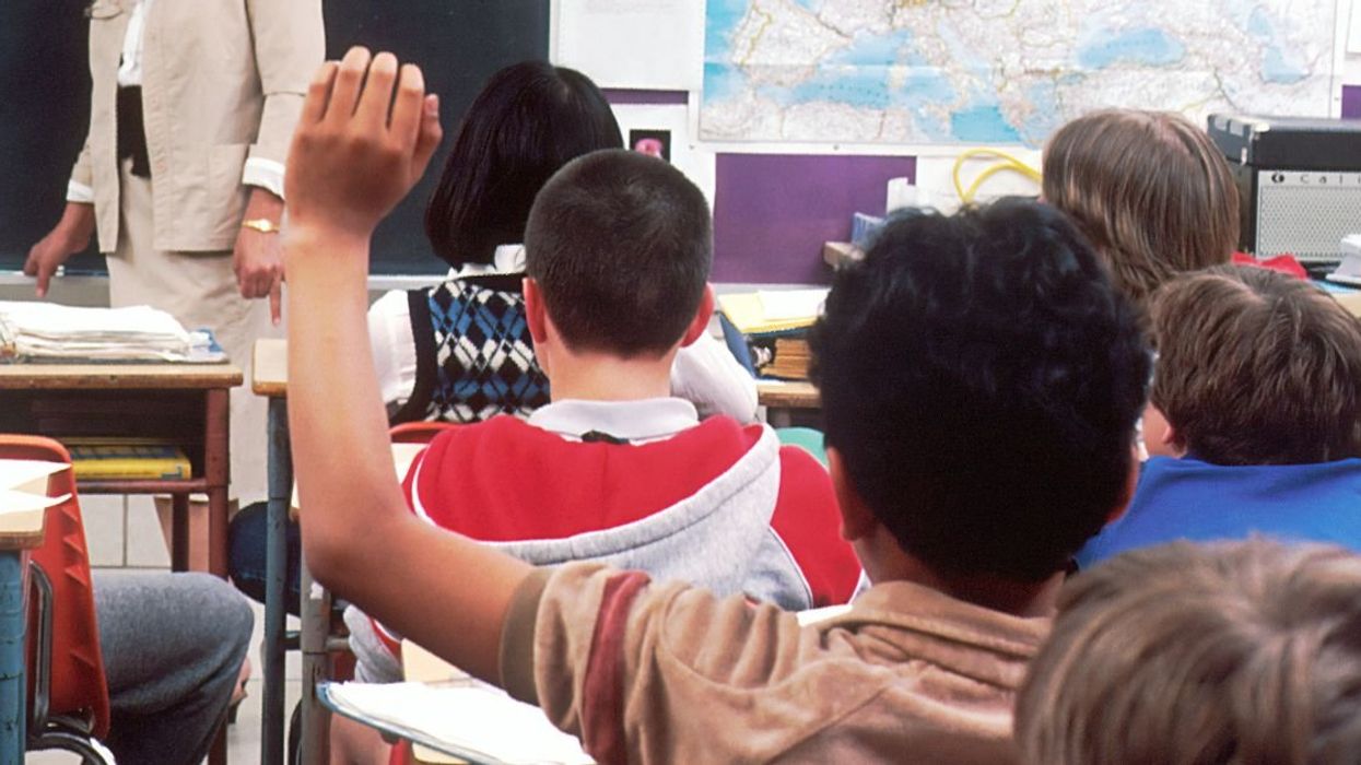 Student raising a hand in class