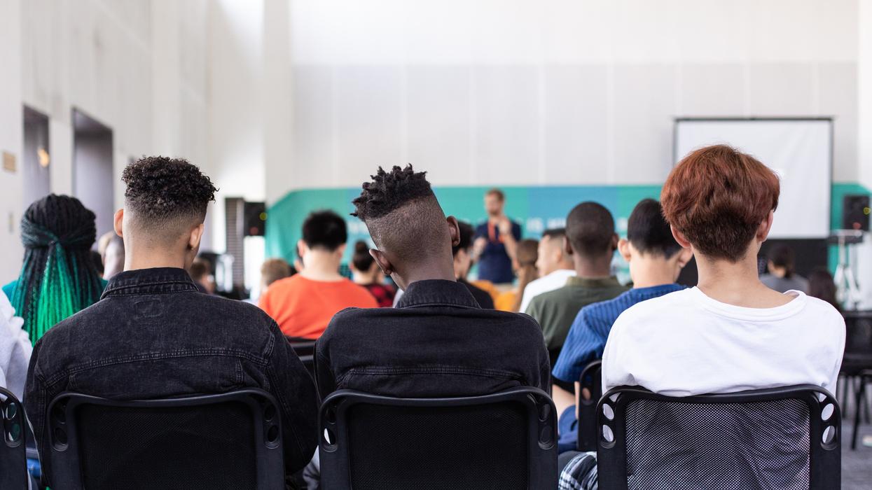 Students sitting in an assembly