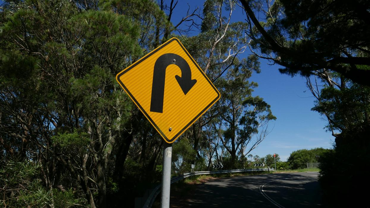 switchback turn road sign