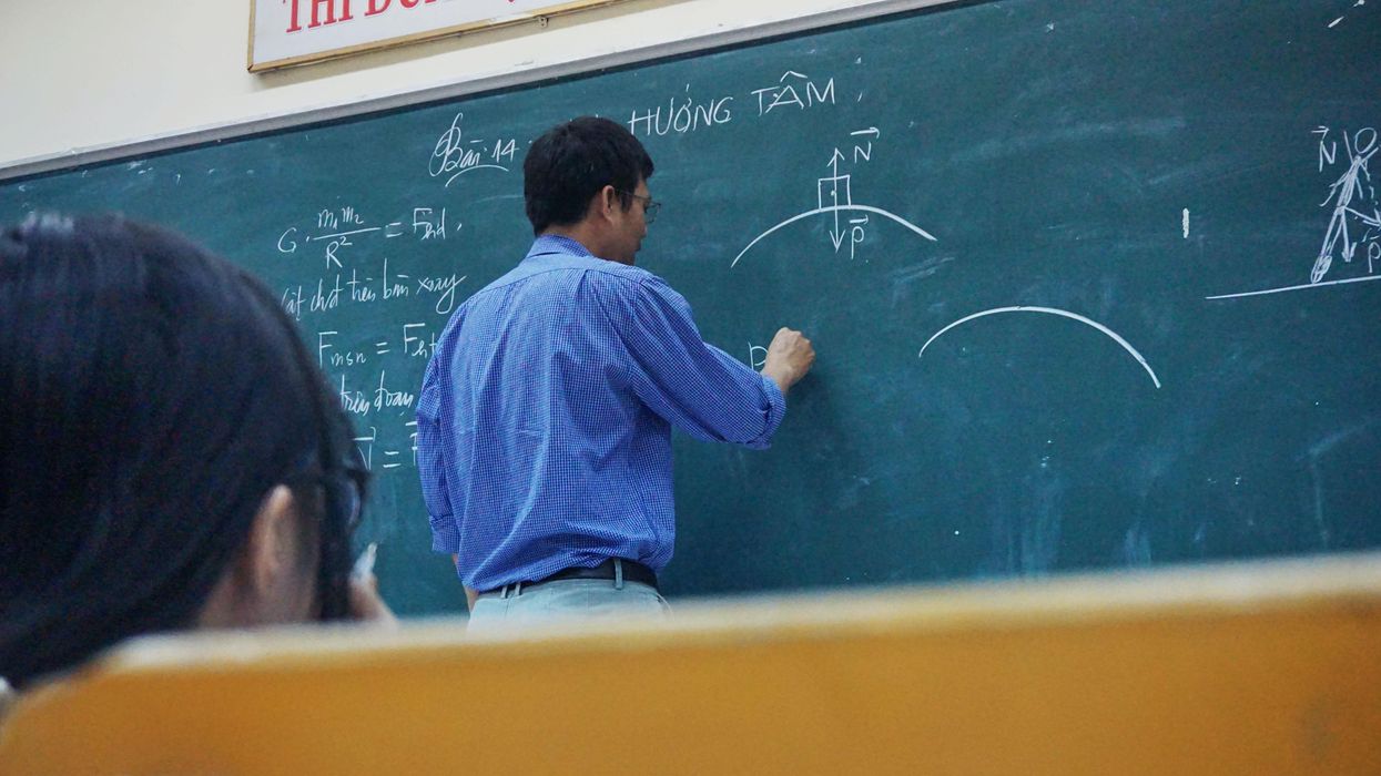 Teacher at a chalkboard