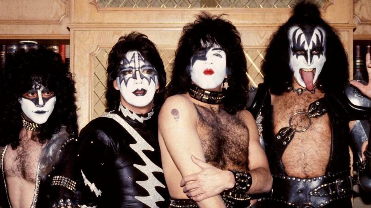 The members of KISS pose in full makeup and costume during their classic-era heyday, capturing the band’s signature theatrical rock style.