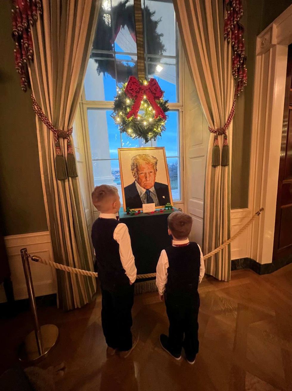 The Posobiec boys in front of a Lego Trump portrait