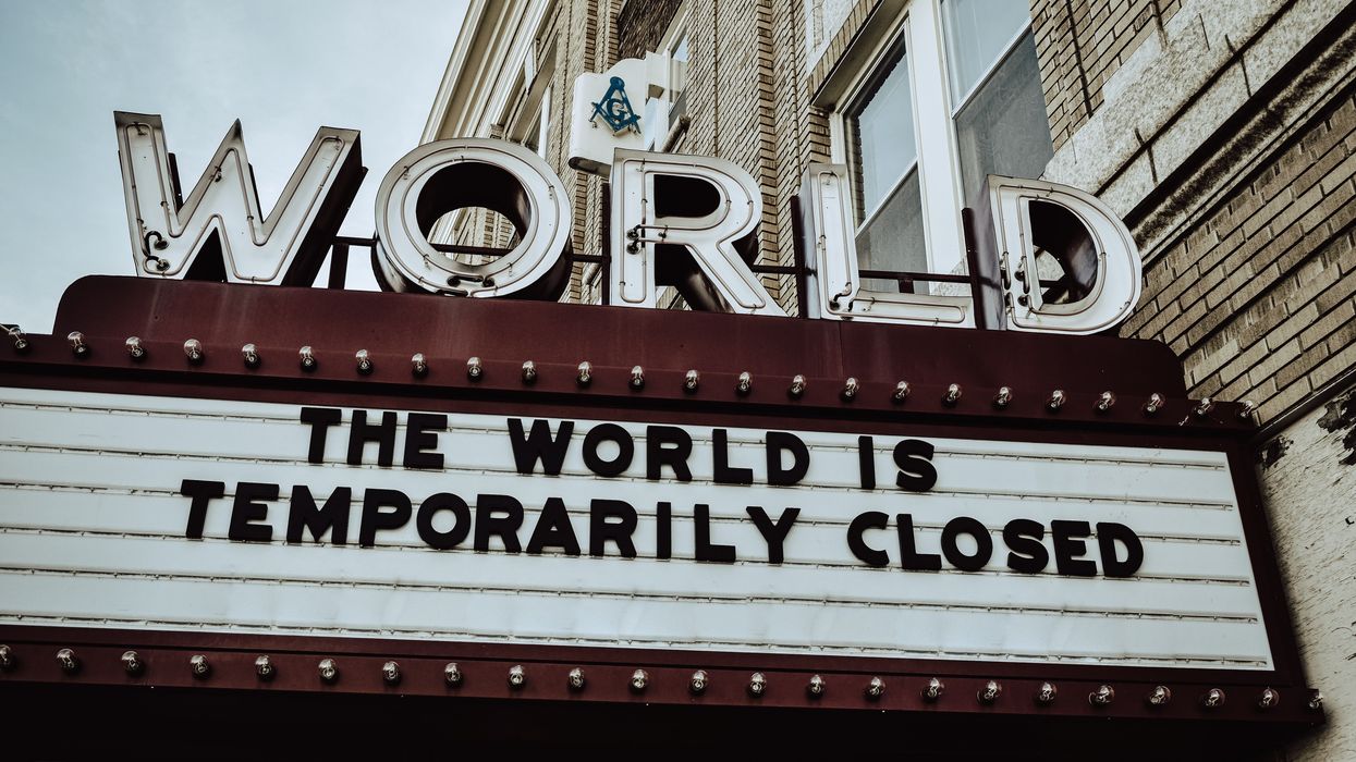 The World Theatre's placard, which reads, "The World is Temporarily Closed"