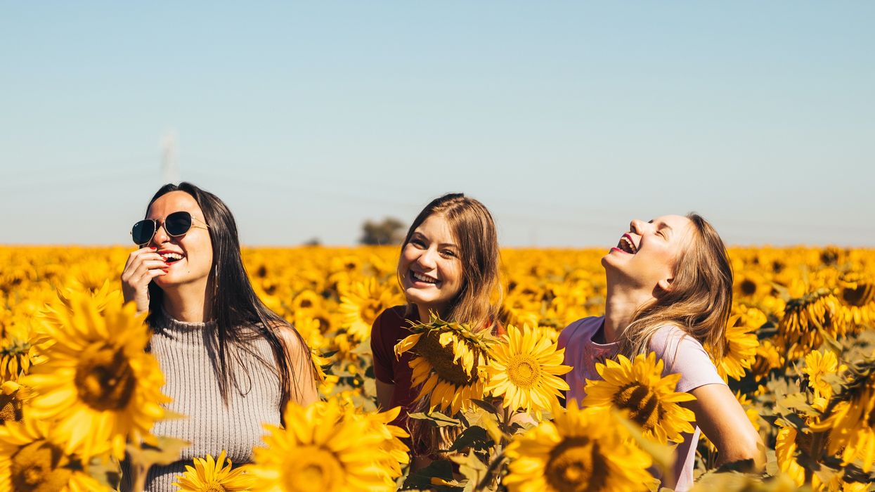 Three young women laughing together