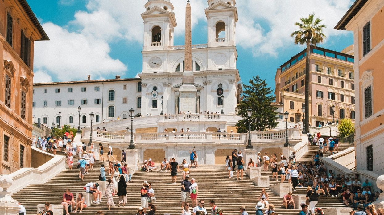 tourists on stairs leading to cathedral
