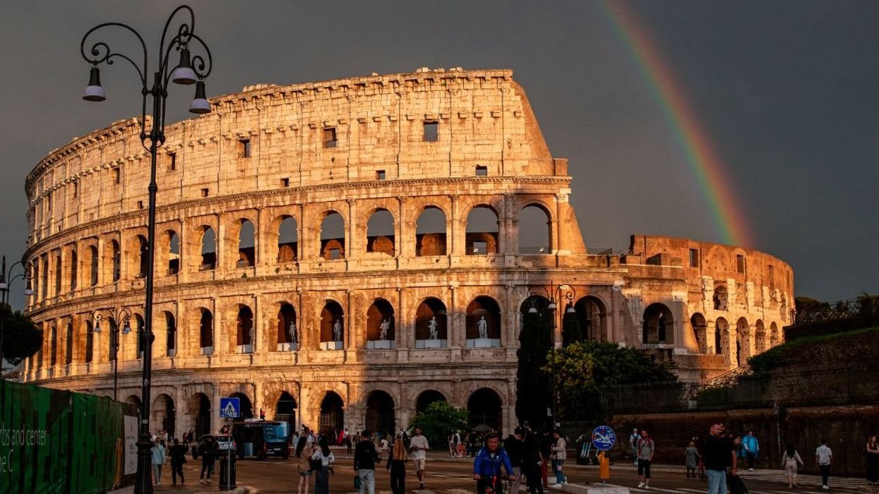 Tourists visit Rome's iconic ancient amphitheater, the Colosseum