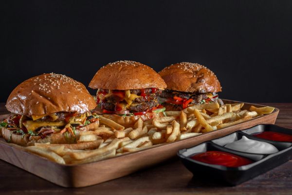 Tray of fast food burgers and fries