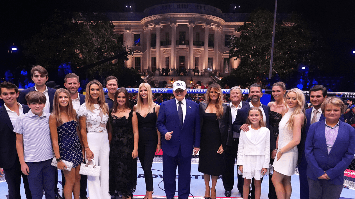 Trump family pose for a photo in the UFC Octagon at the White House