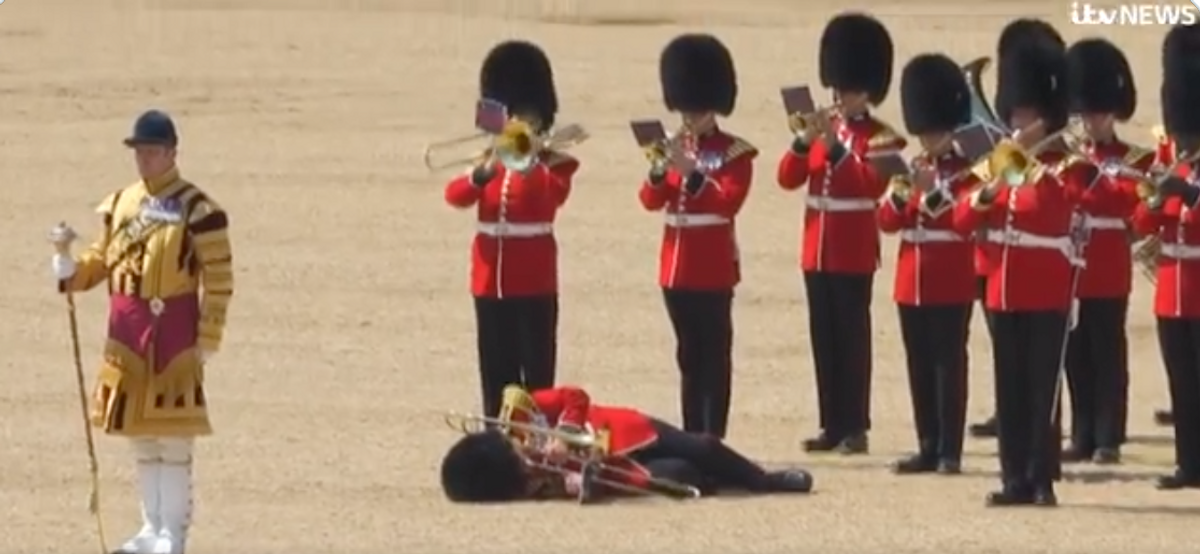 Twitter screenshot of parade, collapsed soldier
