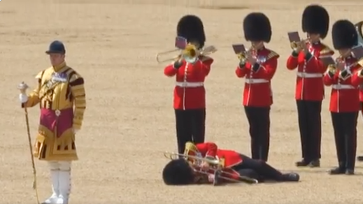 Twitter screenshot of parade, collapsed soldier