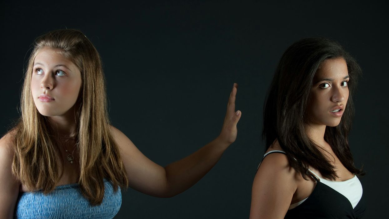 two girls on black background