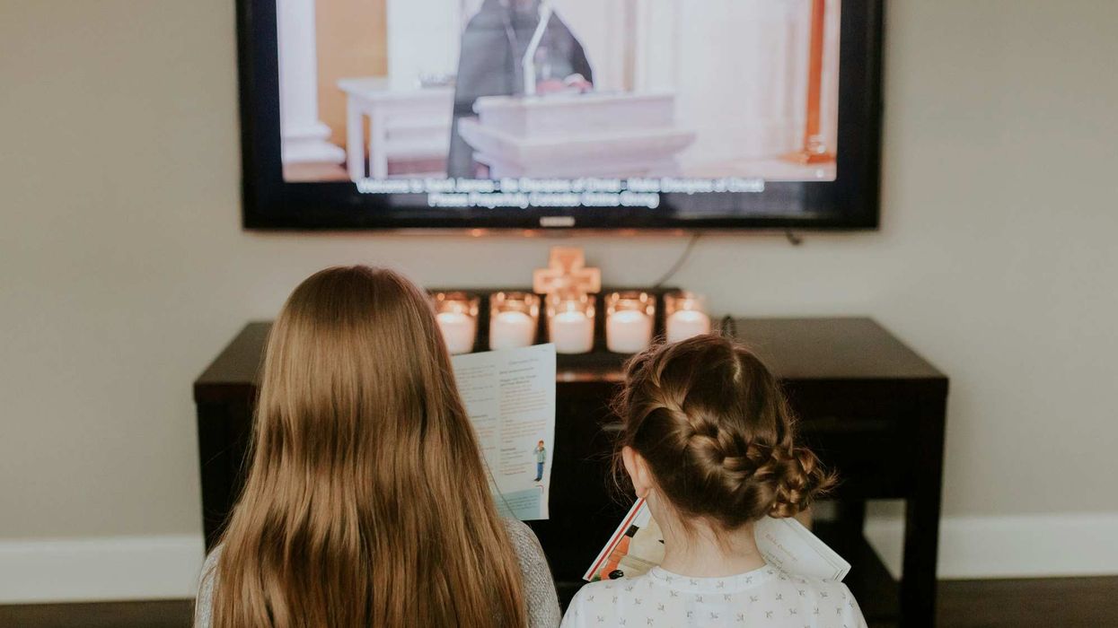 Two girls watching television