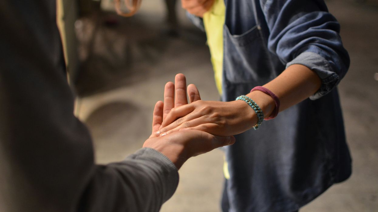 Two hands letting go