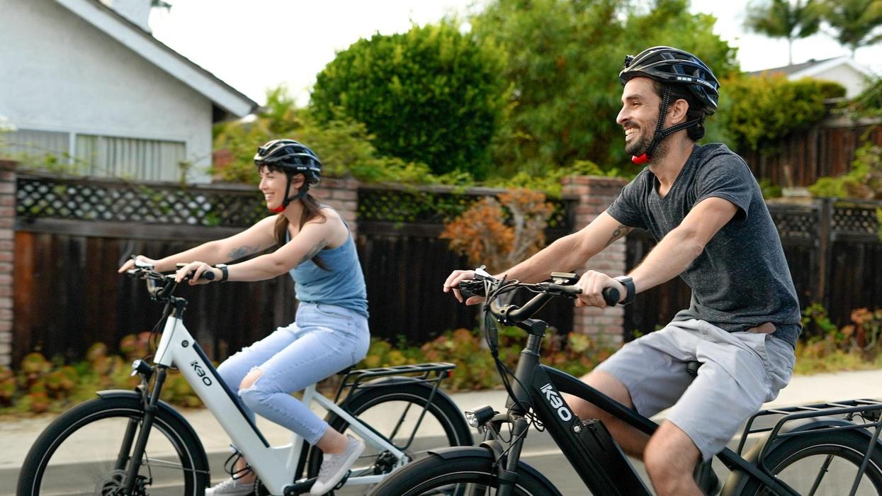Two middle aged people riding bikes