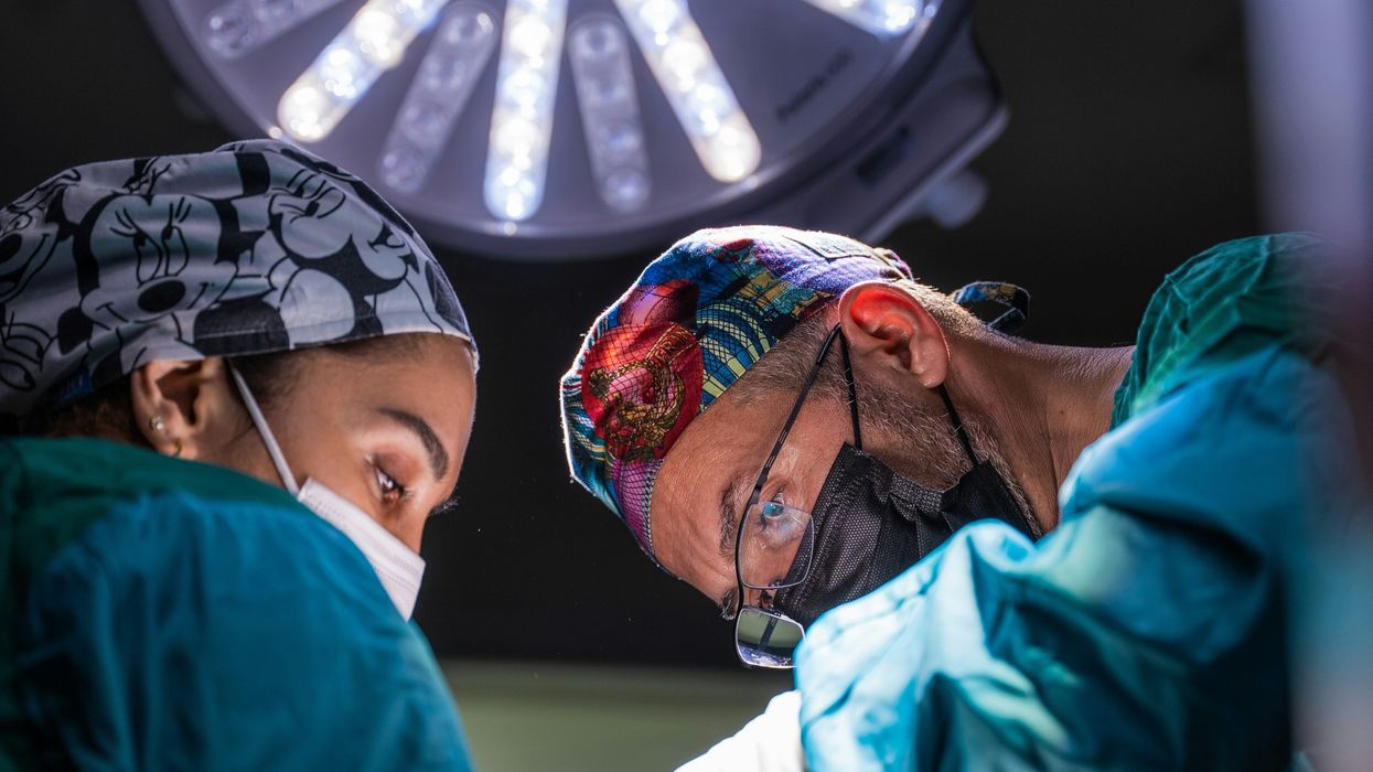two surgeons performing surgery