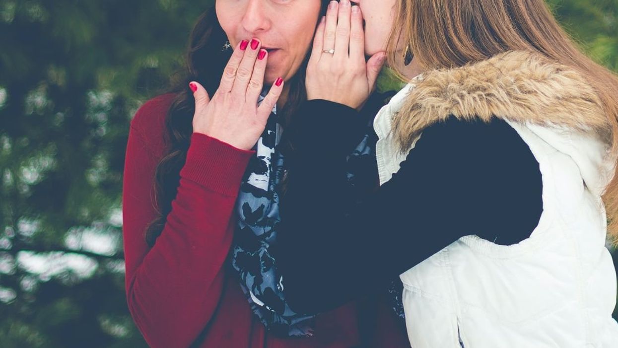 Two women gossiping