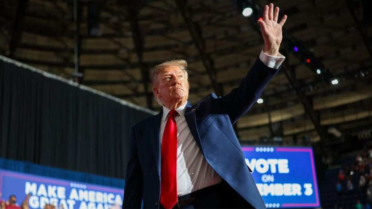 U.S. President Donald Trump waves as he leaves the stage after speaking during a campaign rally at the Freeman Coliseum.