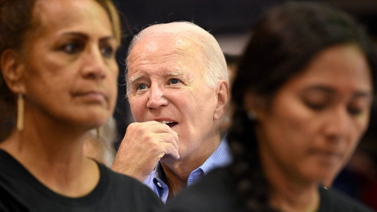 US President Joe Biden gestures as he listens to a speaker during a community engagement event at the Lahaina Civic Center in Lahaina, Hawaii