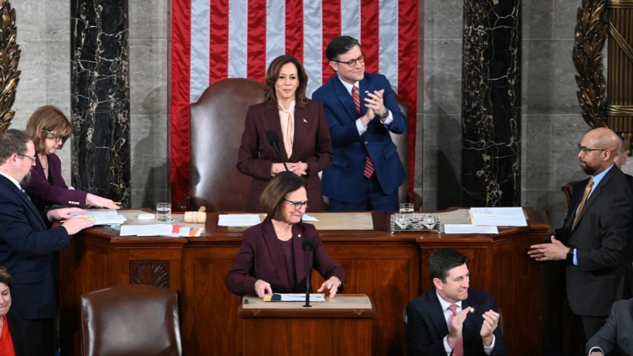 Vice President Kamala Harris certifies the Electoral College vote alongside U.S. Speaker of the House Mike Johnson