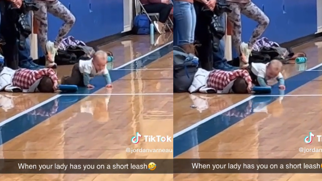 Video of mother with baby on a baby leash