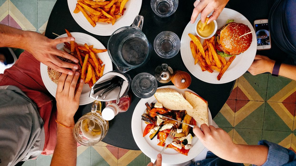 View from above of four seated diners at a restaruant