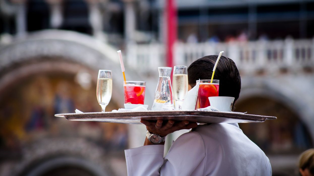 Waiter holding a tray of beverages
