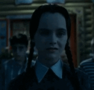 Wednesday Addams smile GIF