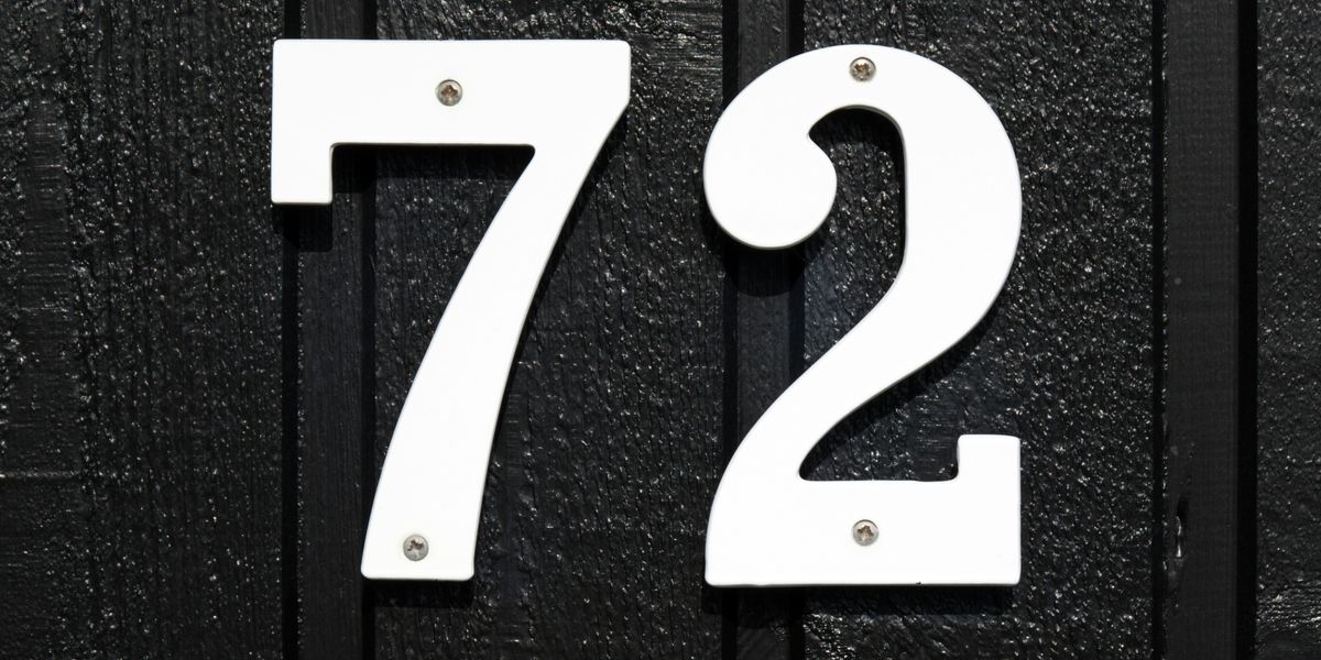 white 72 on a black surface