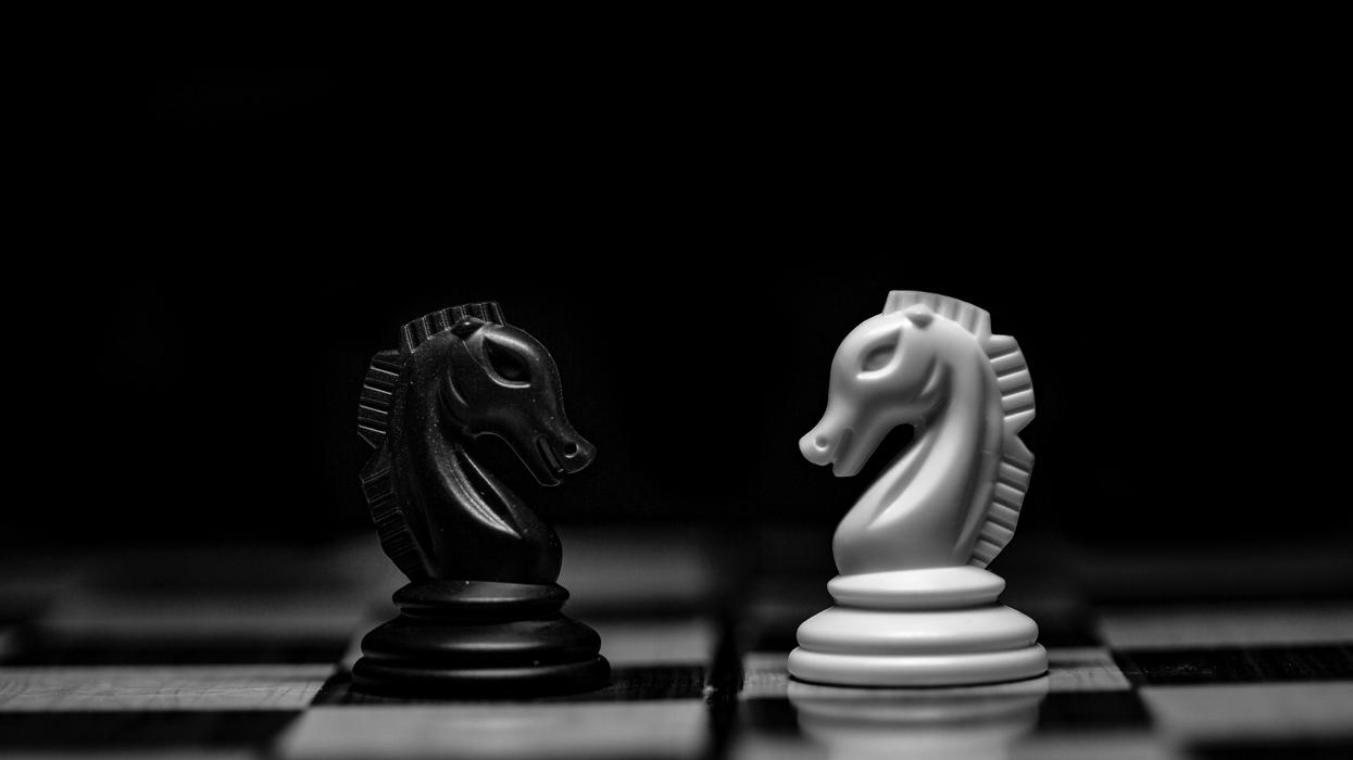 white ceramic figurine on black table