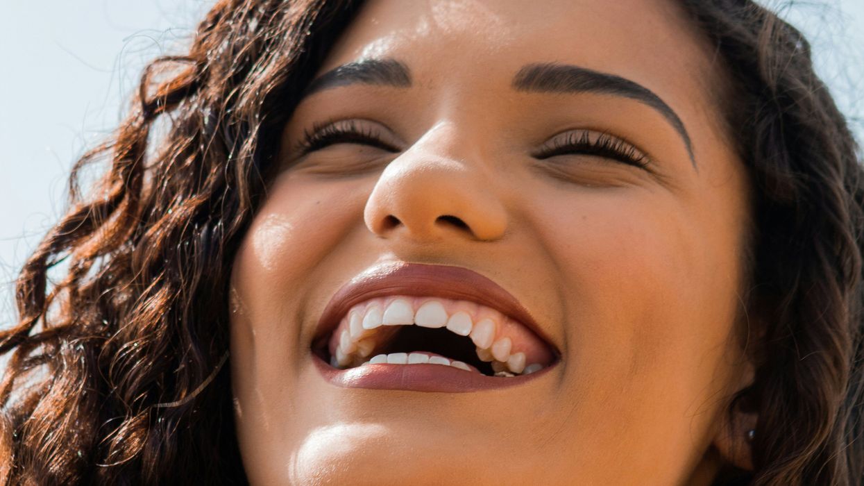 Woman flashing healty teeth