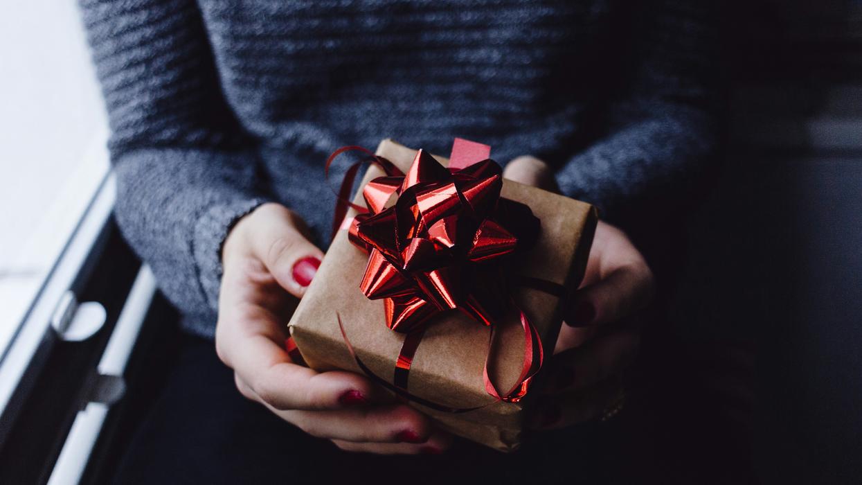 Woman holding a wrapped gift