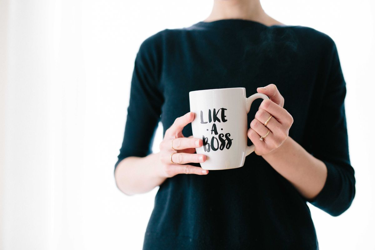 Woman holds Like A Boss mug