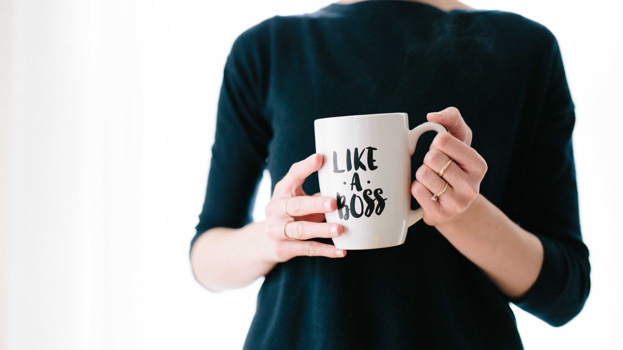 Woman holds Like A Boss mug